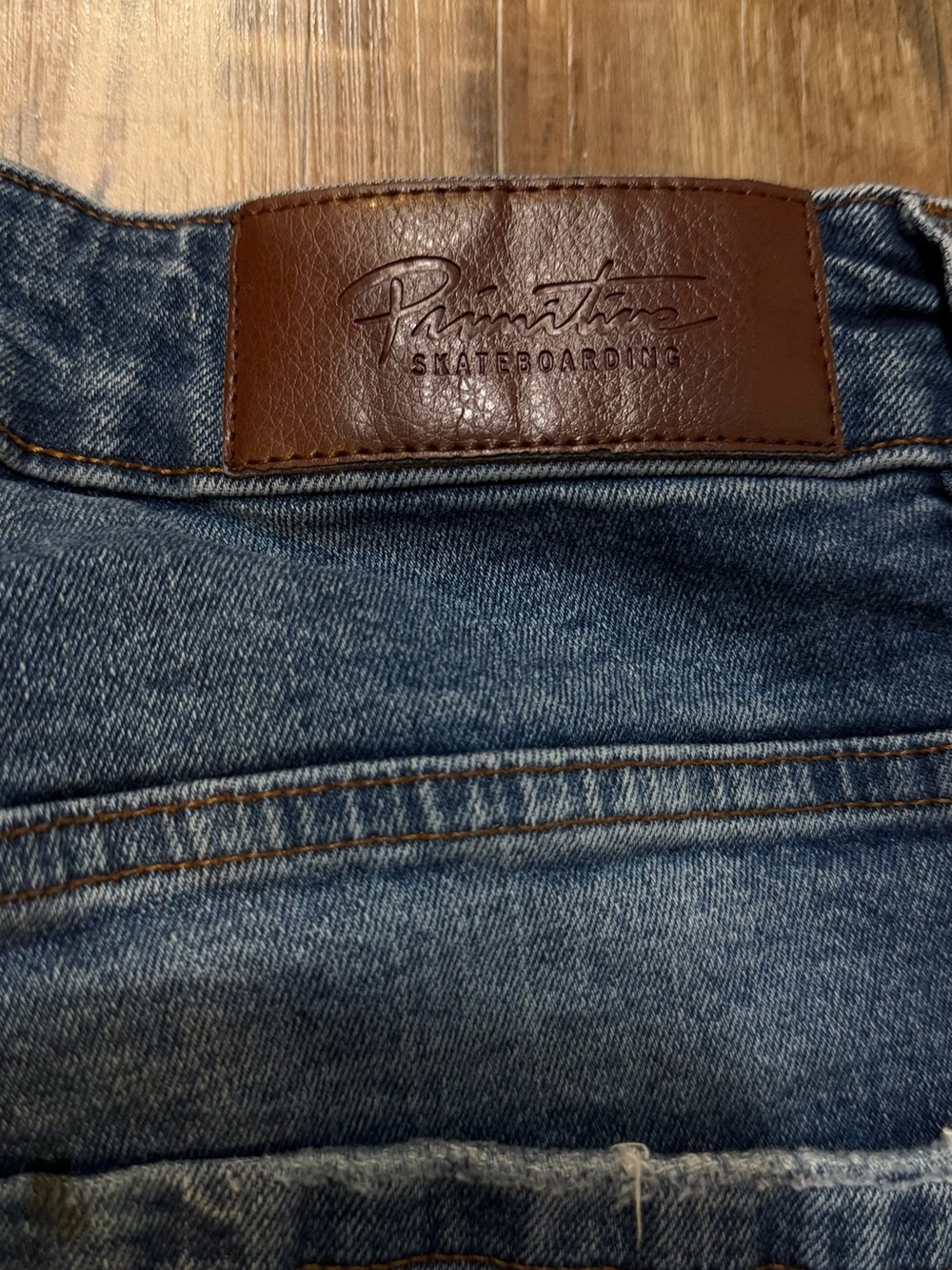 Primitive Brown Leather Patch on Blue Denim Jeans